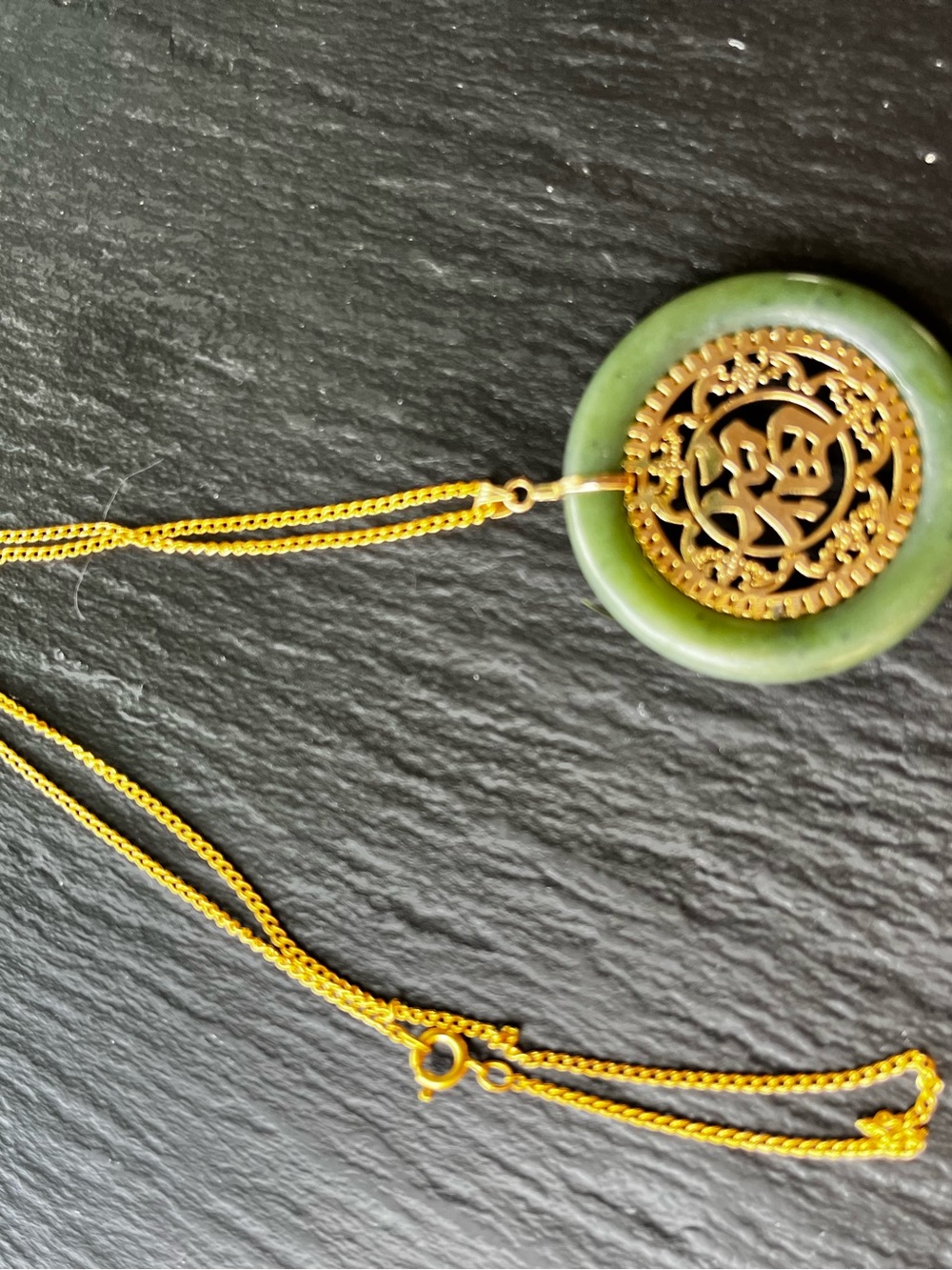 Green Jade Happiness pendant with 24” gold chain.